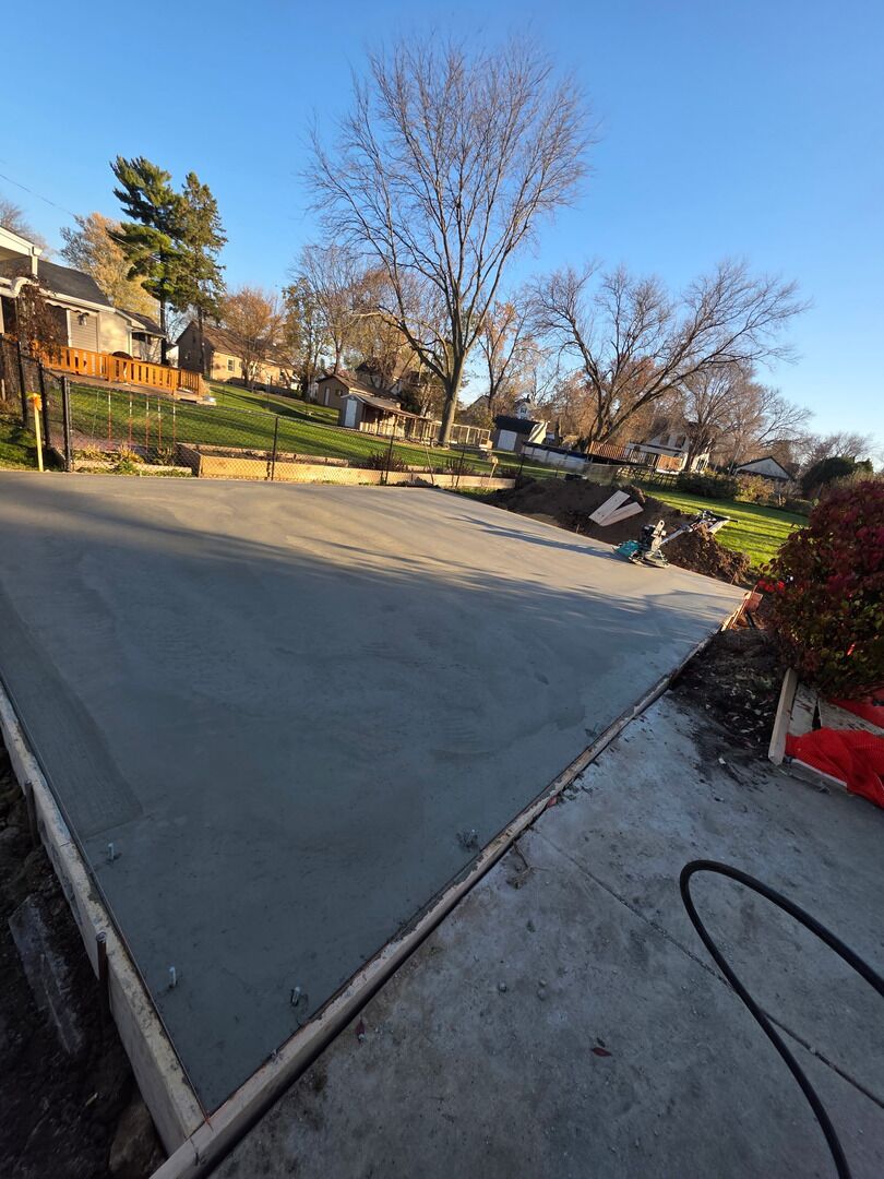 Freshly finished concrete slab still in its forms